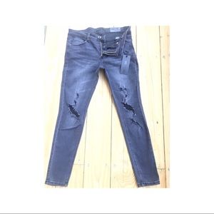 Black lightly ripped mid rise jegging skinny jeans